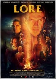 Movie poster for Lore (2023), with a bunch of faces and scary figures around a campfire.