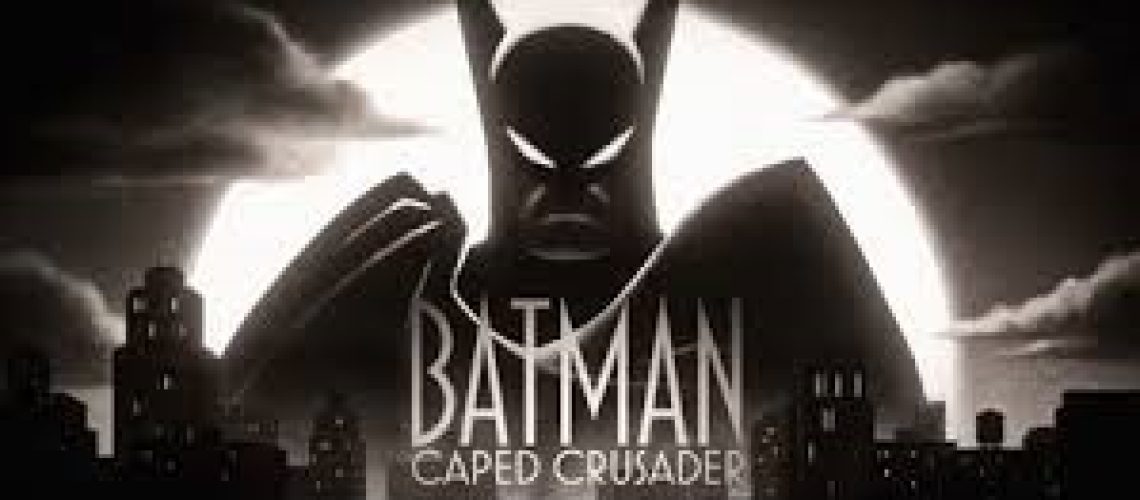Title card of Batman: Caped Crusader, featuring a menacing man in a sharp-eared bat mask and cloak looming over a cityscape, with a full moon and clouds behind him.